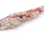 A piece of meat is laying on the ground.