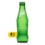 A bottle of sprite sits on the table.