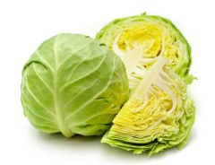 A close up of some green vegetables on a white surface