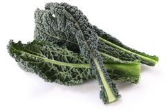 A close up of some green vegetables on a white surface