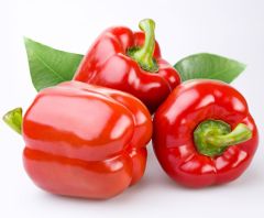 A close up of some red peppers on a table