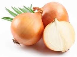 A close up of onions on a white surface