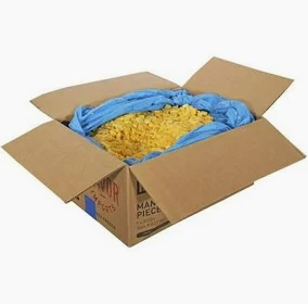 A box of macaroni and cheese with blue paper in it.