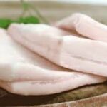 A close up of some meat on a plate